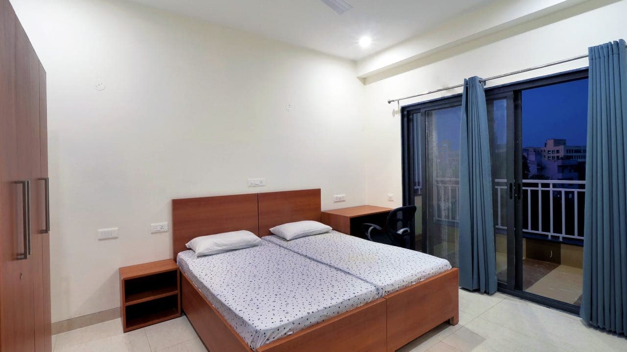 Furnished 1RK studio apartment with bed, wardrobe and balcony