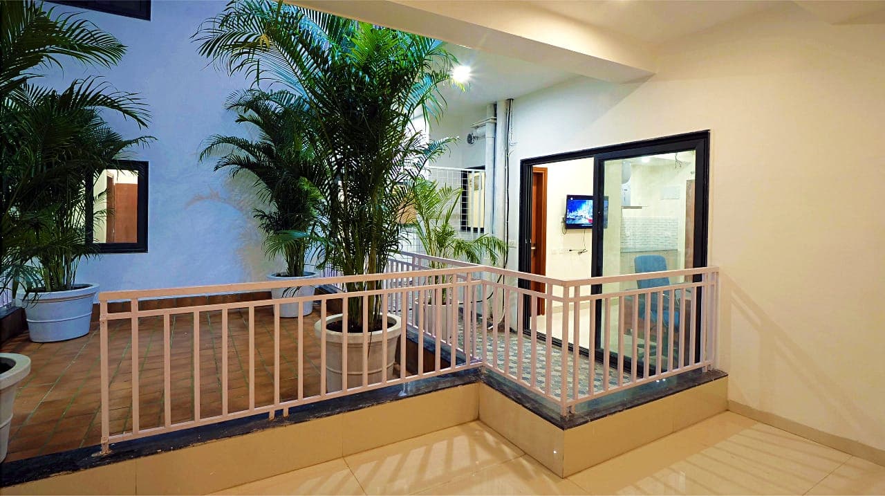 Balcony stairs with potted palms